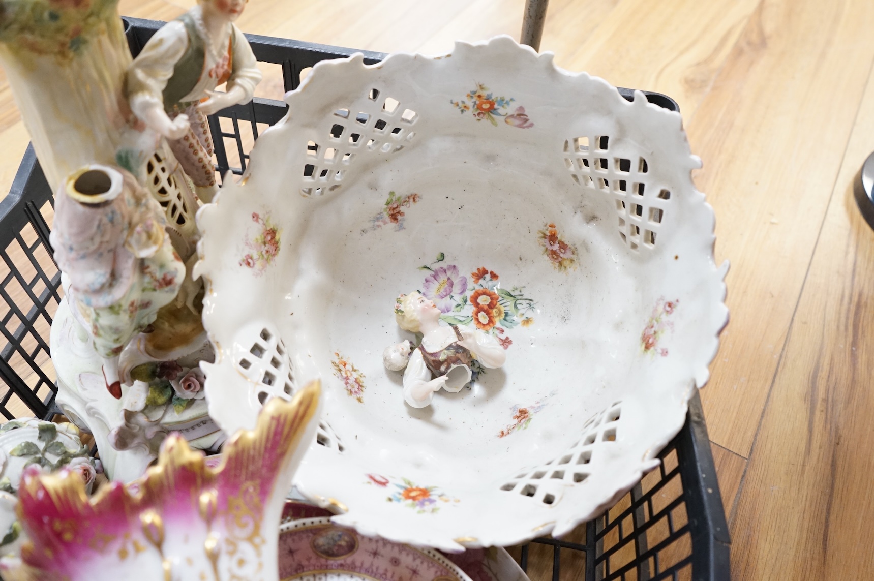 A German porcelain figural centrepiece, lobed dish, three other plates and two others